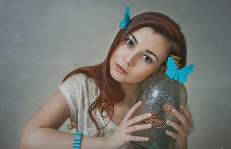Woman Holding Glass Bottle