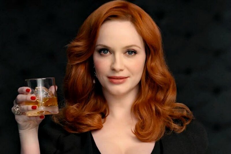 Woman Holding Glass — Red, Confident