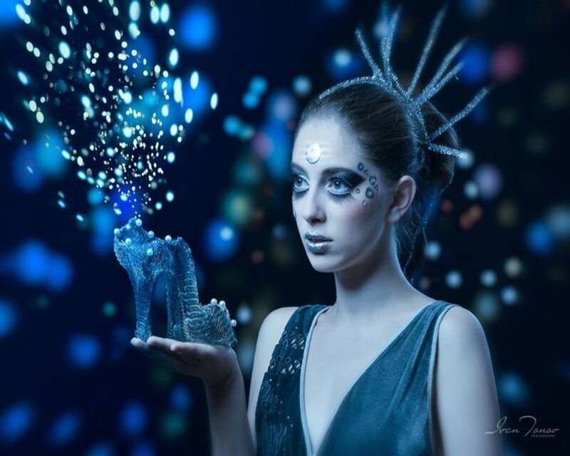 Woman Holding Glass Slipper — Blue
