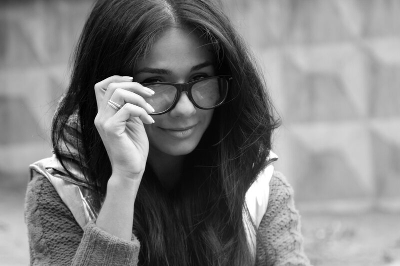woman holding glasses