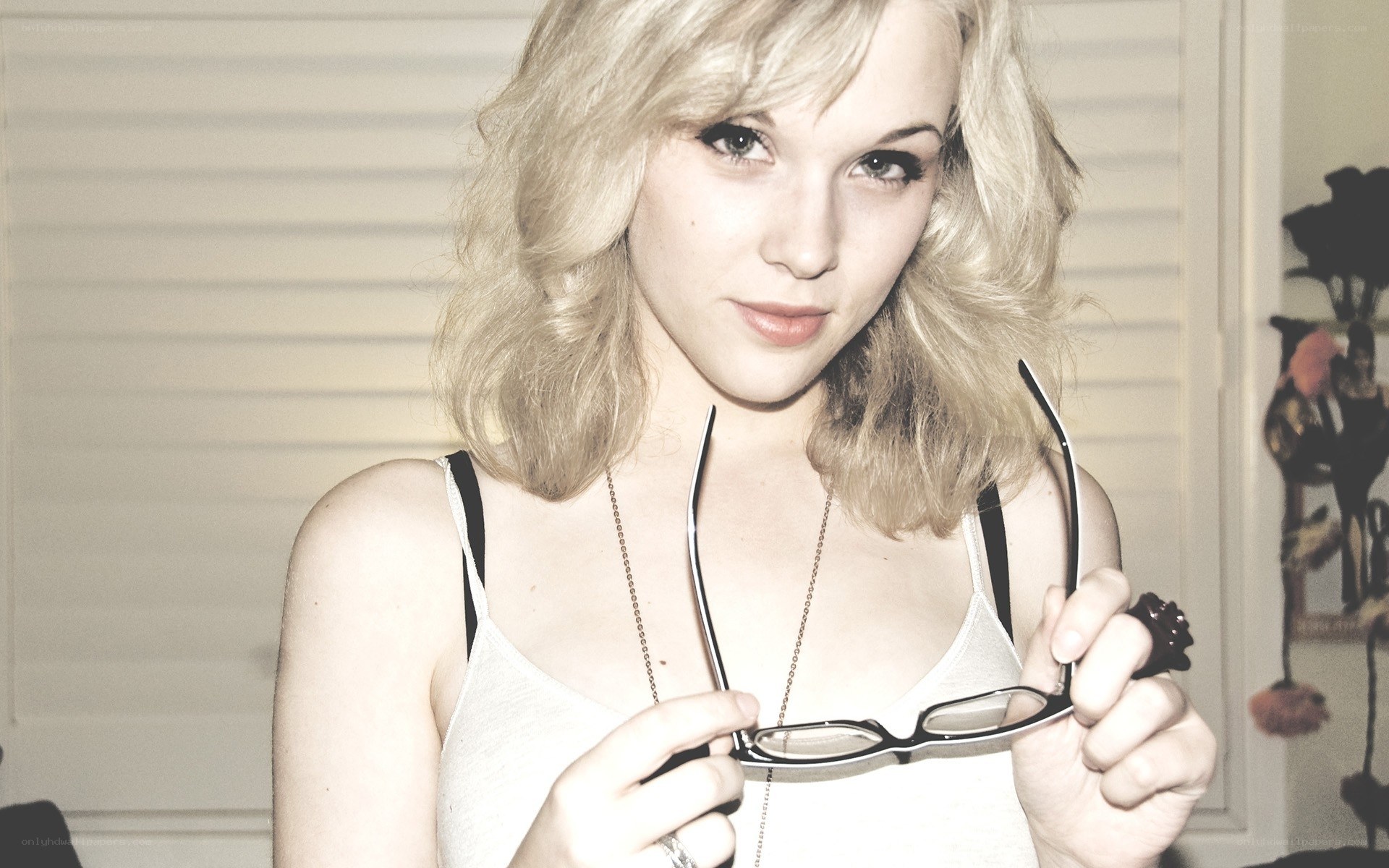 woman holding glasses