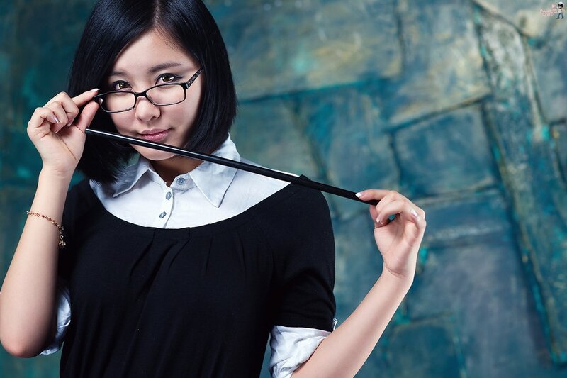 woman holding glasses and cane