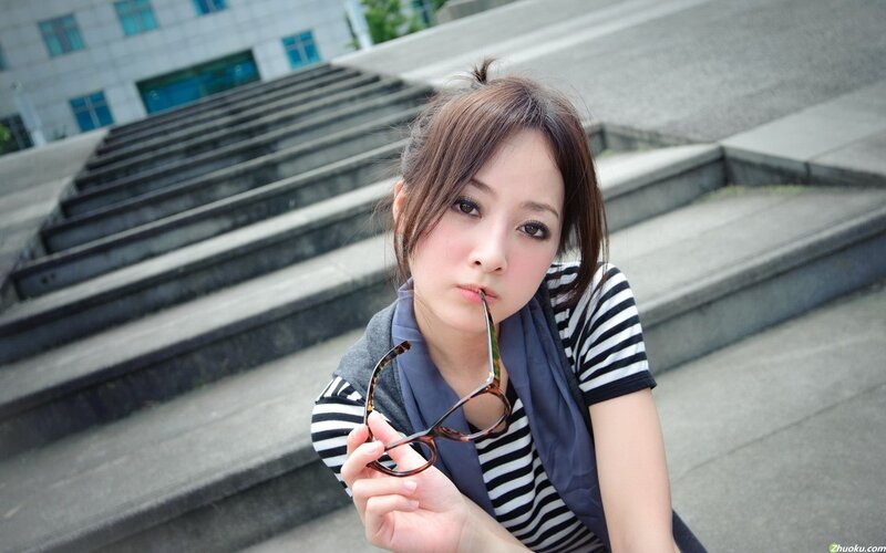 woman holding glasses on stairs