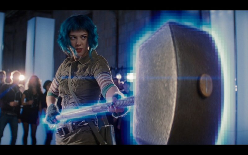 woman holding glowing hammer