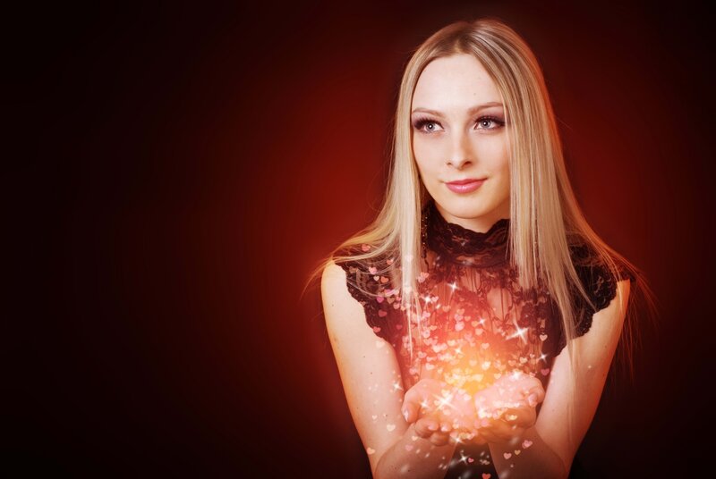 Woman Holding Glowing Hearts — Red