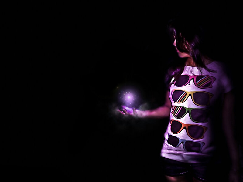 woman holding glowing orb