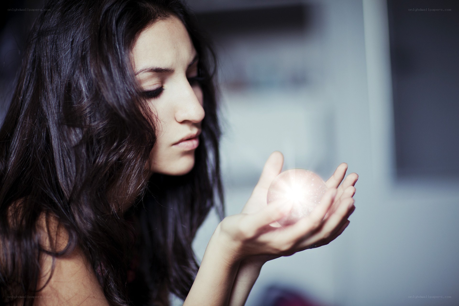 woman holding glowing orb