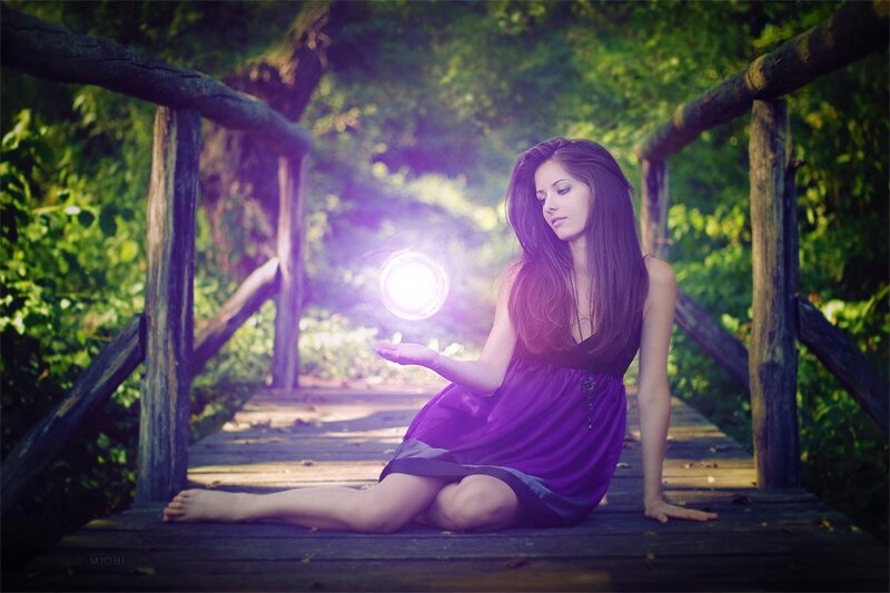 woman holding glowing orb