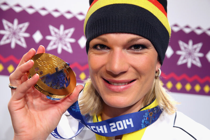 Woman Holding Gold Medal