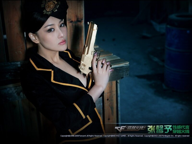 woman holding golden gun