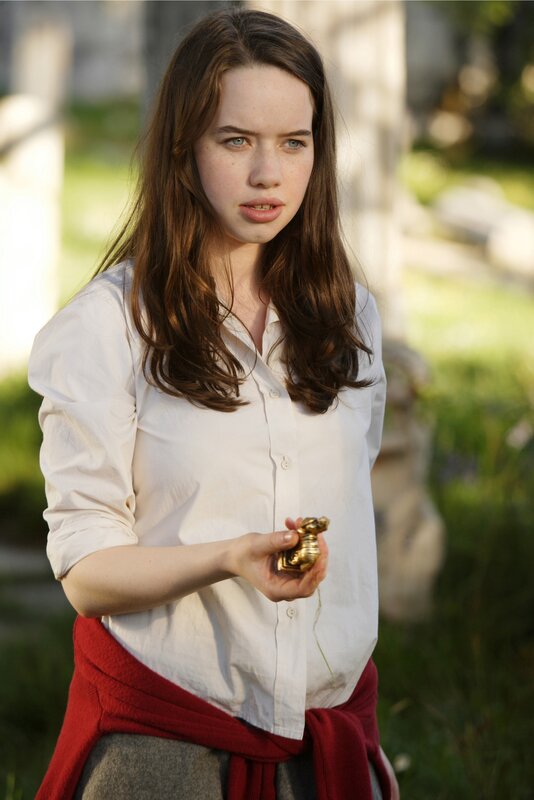 woman holding golden object