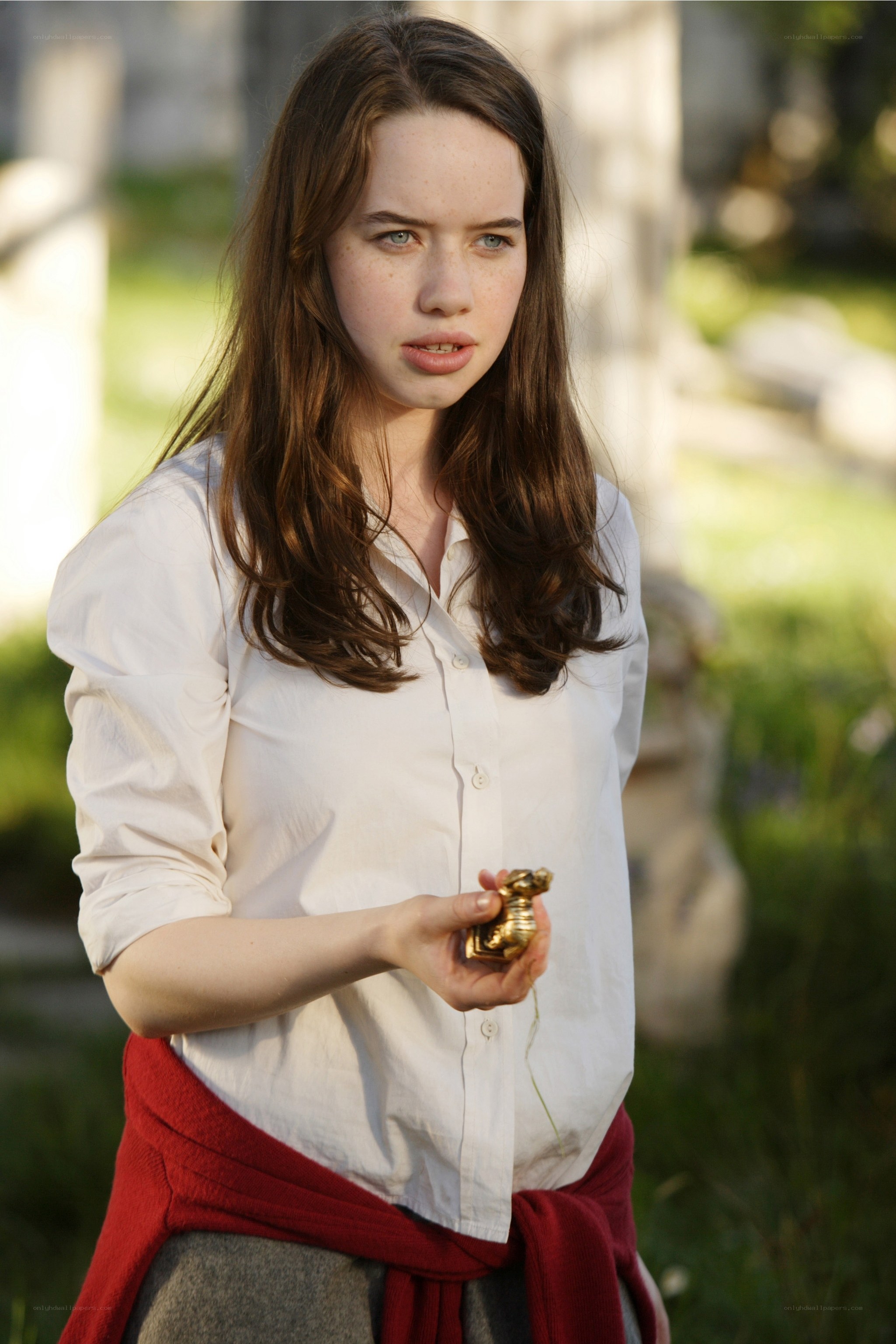 woman holding golden object