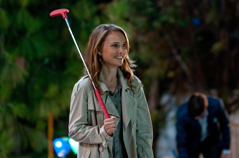 Woman holding golf club