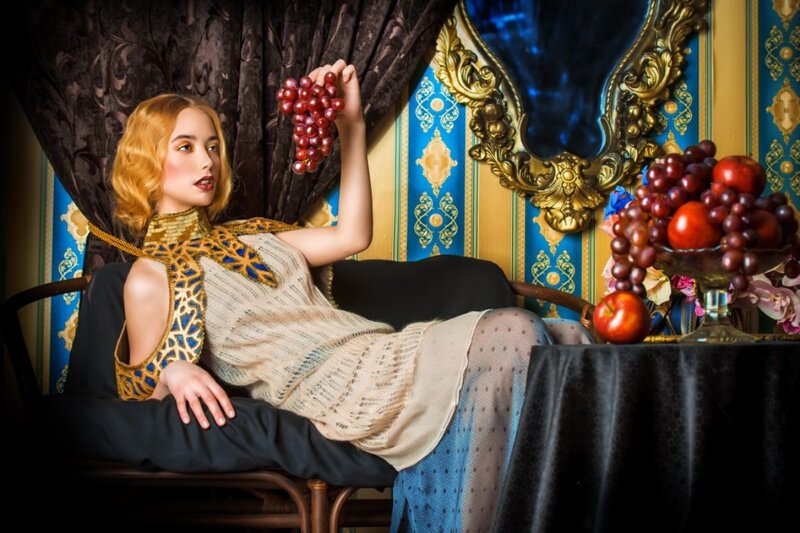 Woman Holding Grapes — Blue