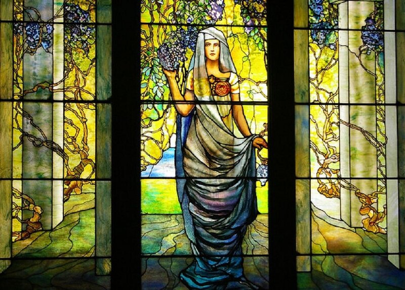 Woman Holding Grapes — Yellow