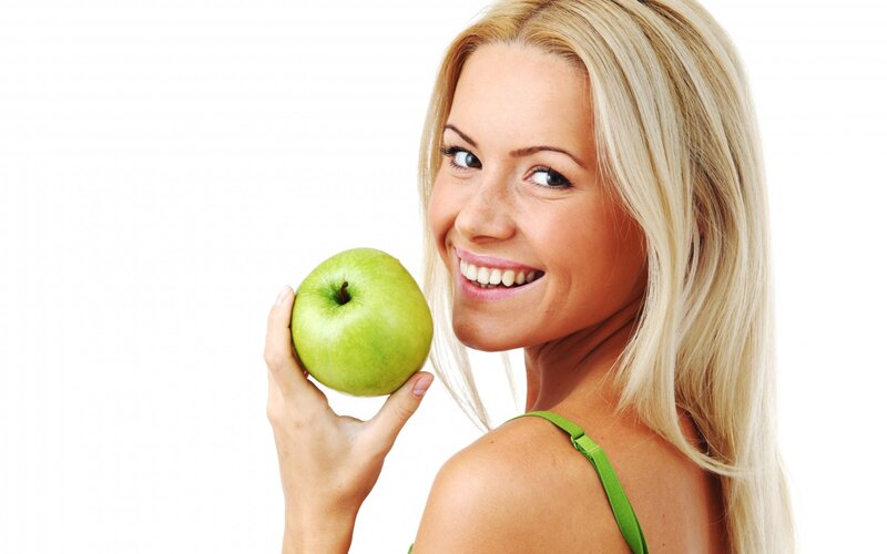 Woman Holding Green Apple — White, Happy