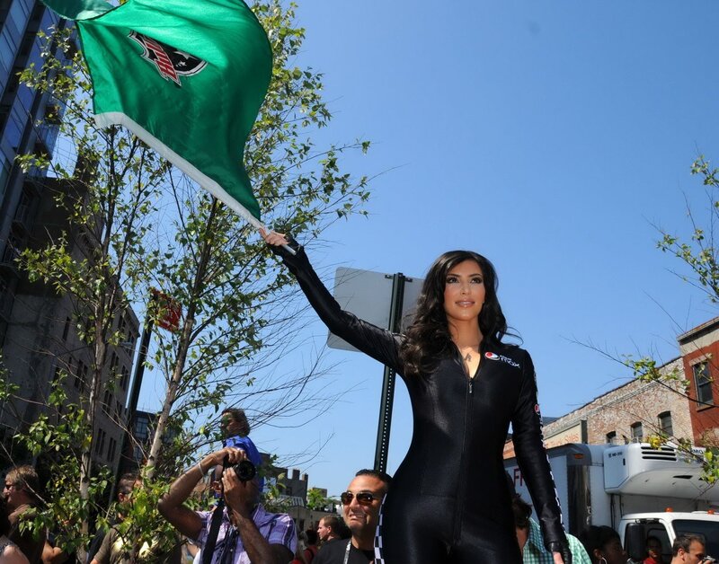 woman holding green flag