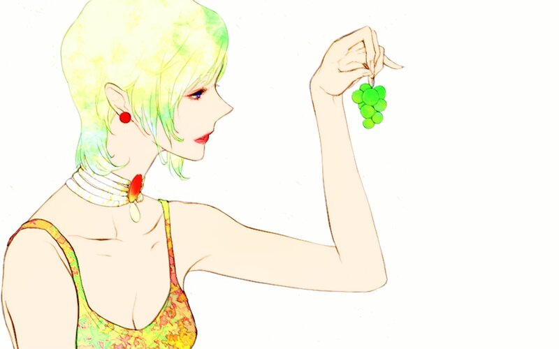 woman holding green grapes
