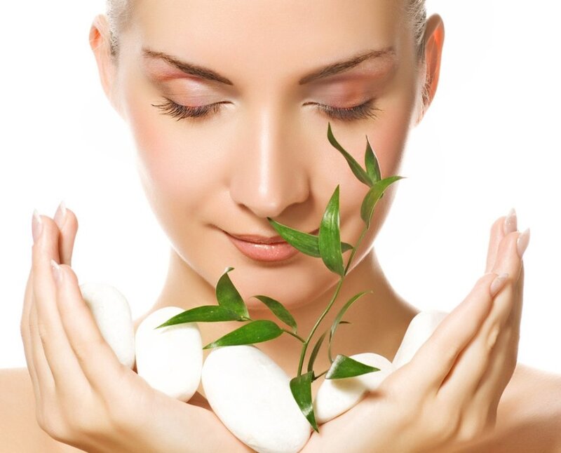 Woman Holding Green Sprig