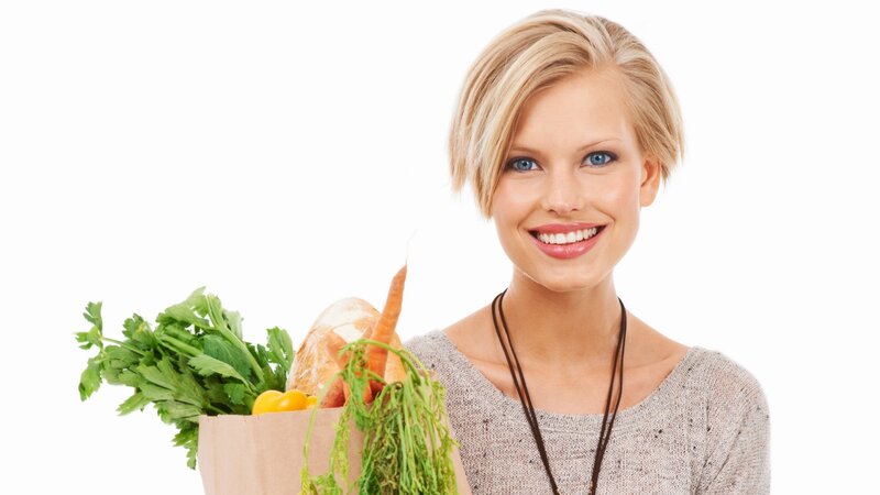 woman holding grocery bag