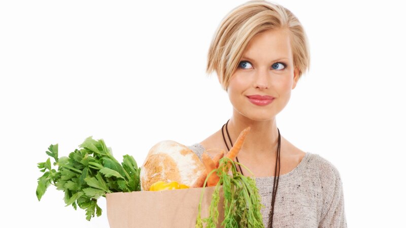 woman holding grocery bag