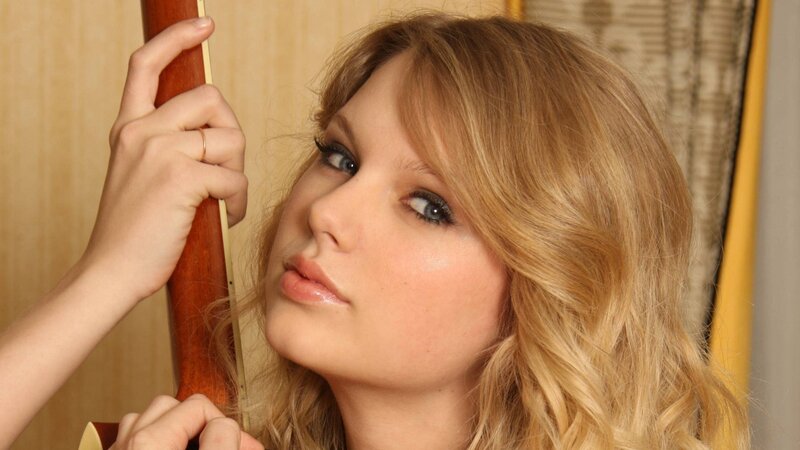 woman holding guitar