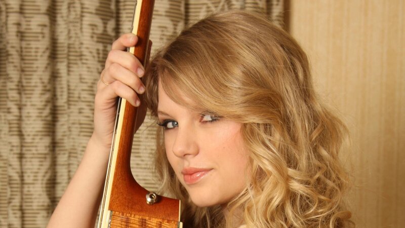 woman holding guitar