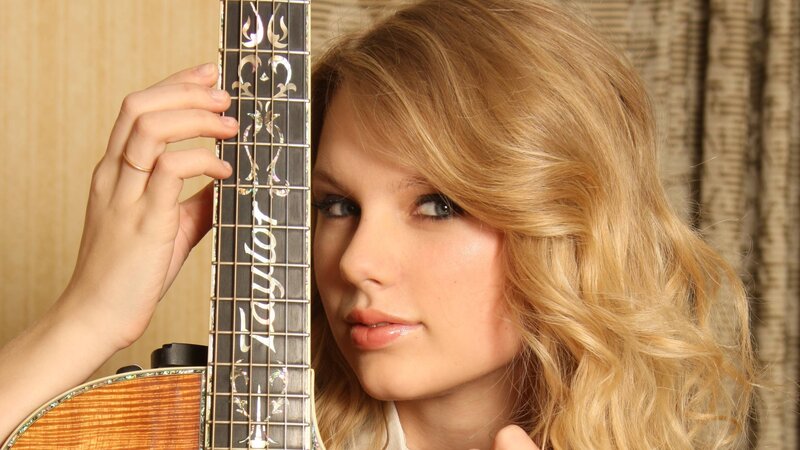 Woman Holding Guitar — Blonde