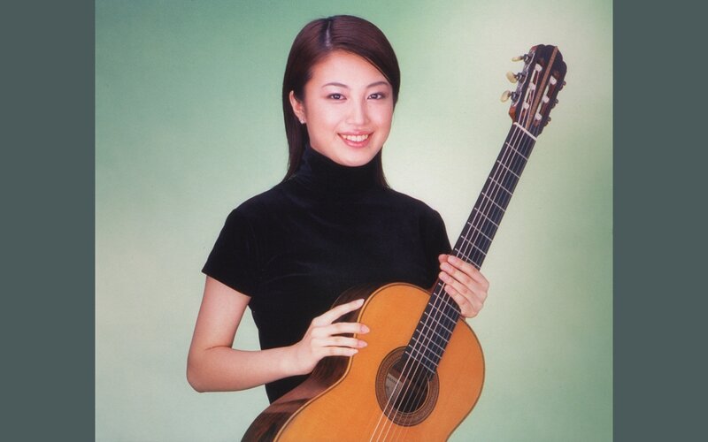 Woman Holding Guitar — Green, Calm