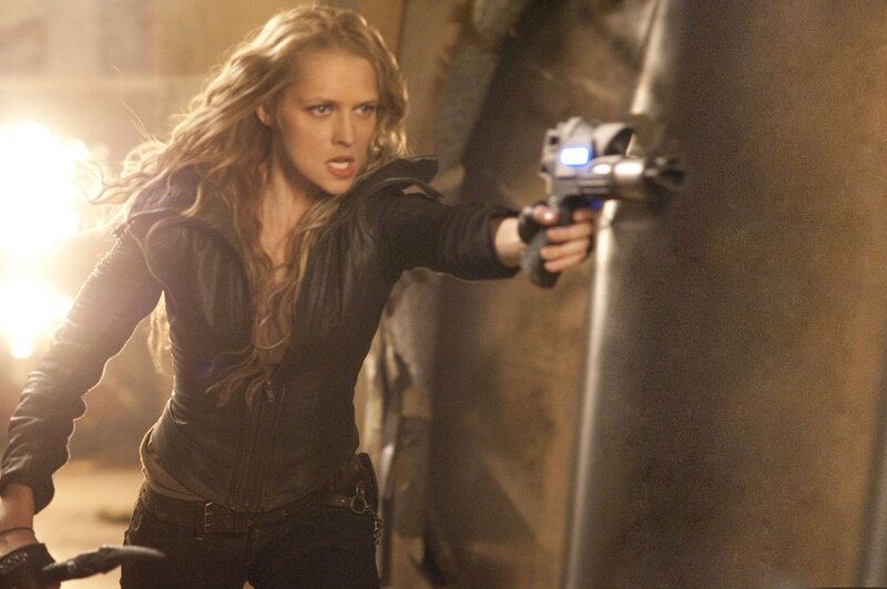 Woman Holding Gun — Black, Tense, Photograph, Leather Jacket