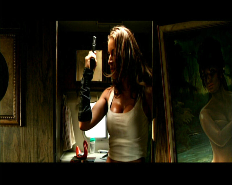 Woman Holding Gun — Brown, Tense