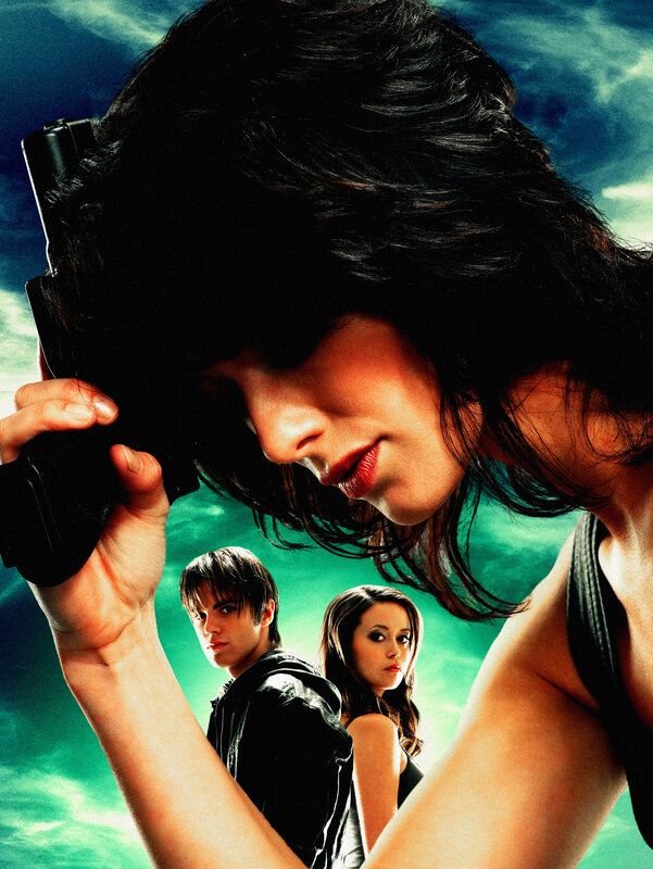 Woman holding gun in action scene
