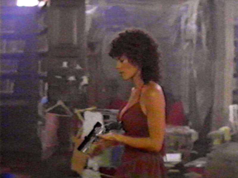 Woman Holding Gun — Red, Tense