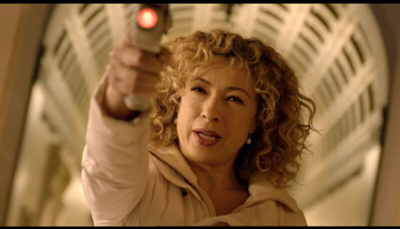 woman holding gun with laser sight