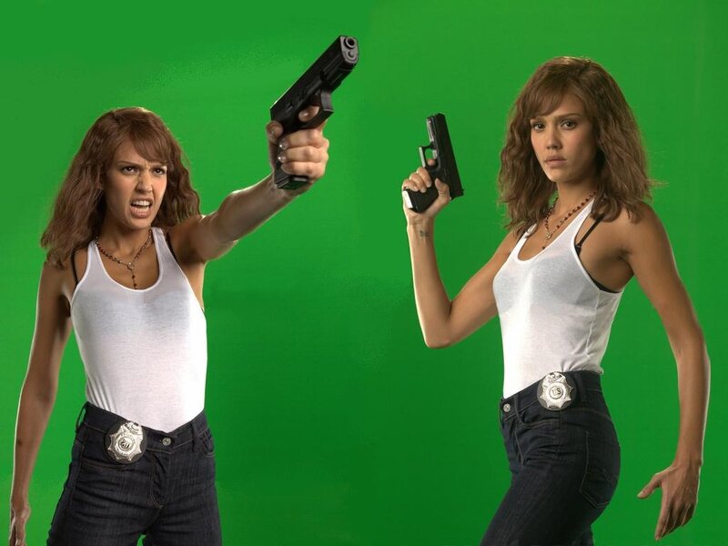 Woman Holding Guns — Green, Intense