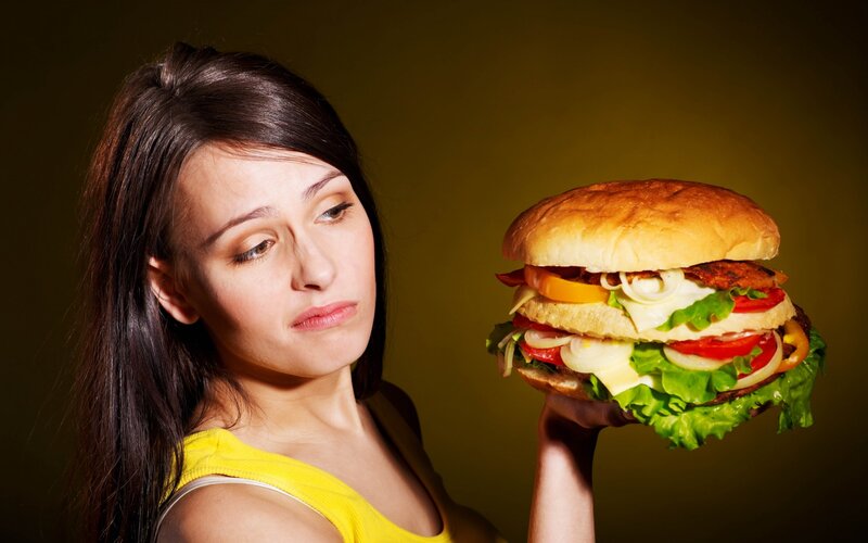 Woman Holding Hamburger