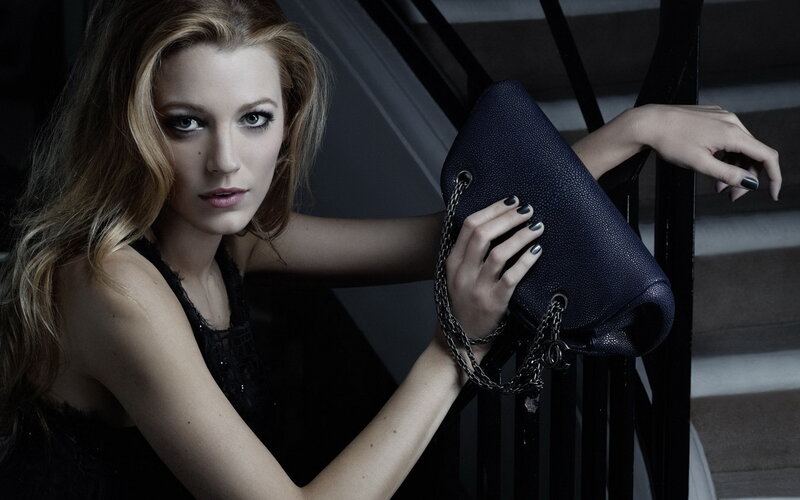 Woman Holding Handbag — Black