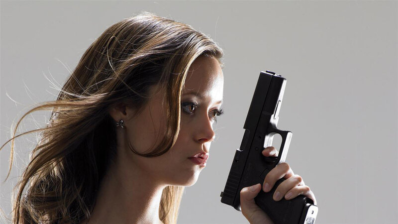 Woman Holding Handgun — Black, Dramatic