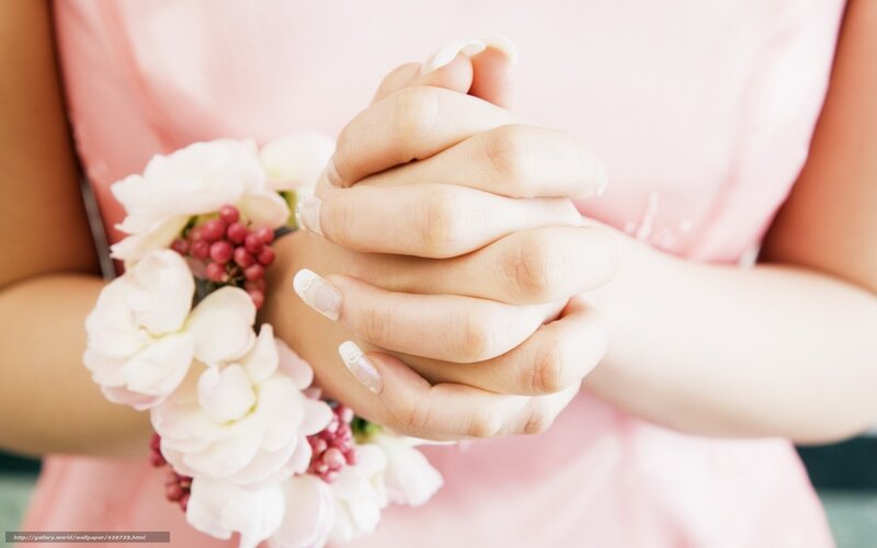 woman holding hands with flowers