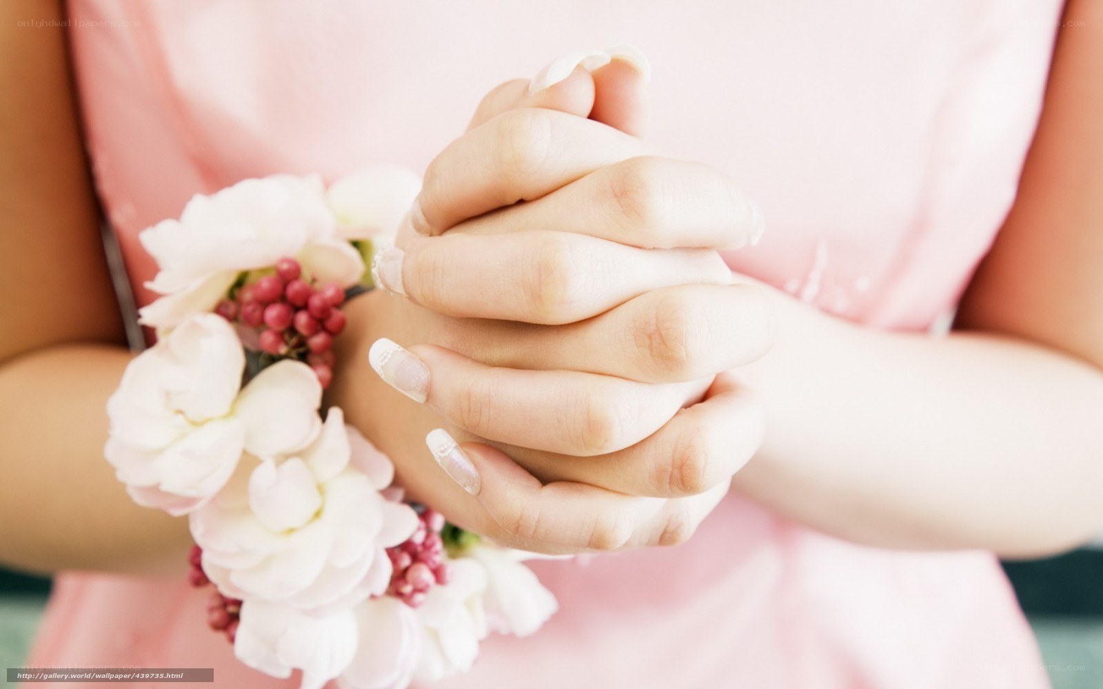woman holding hands with flowers