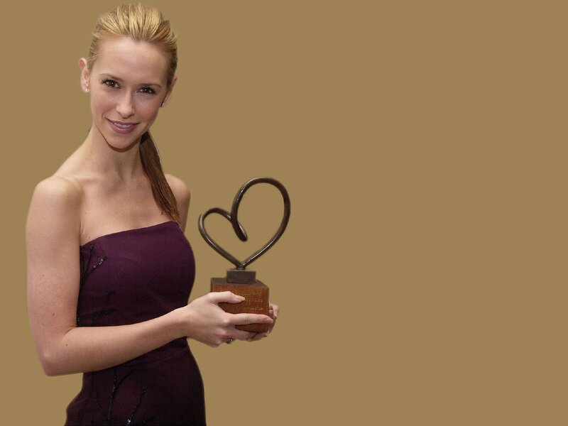 woman holding heart award