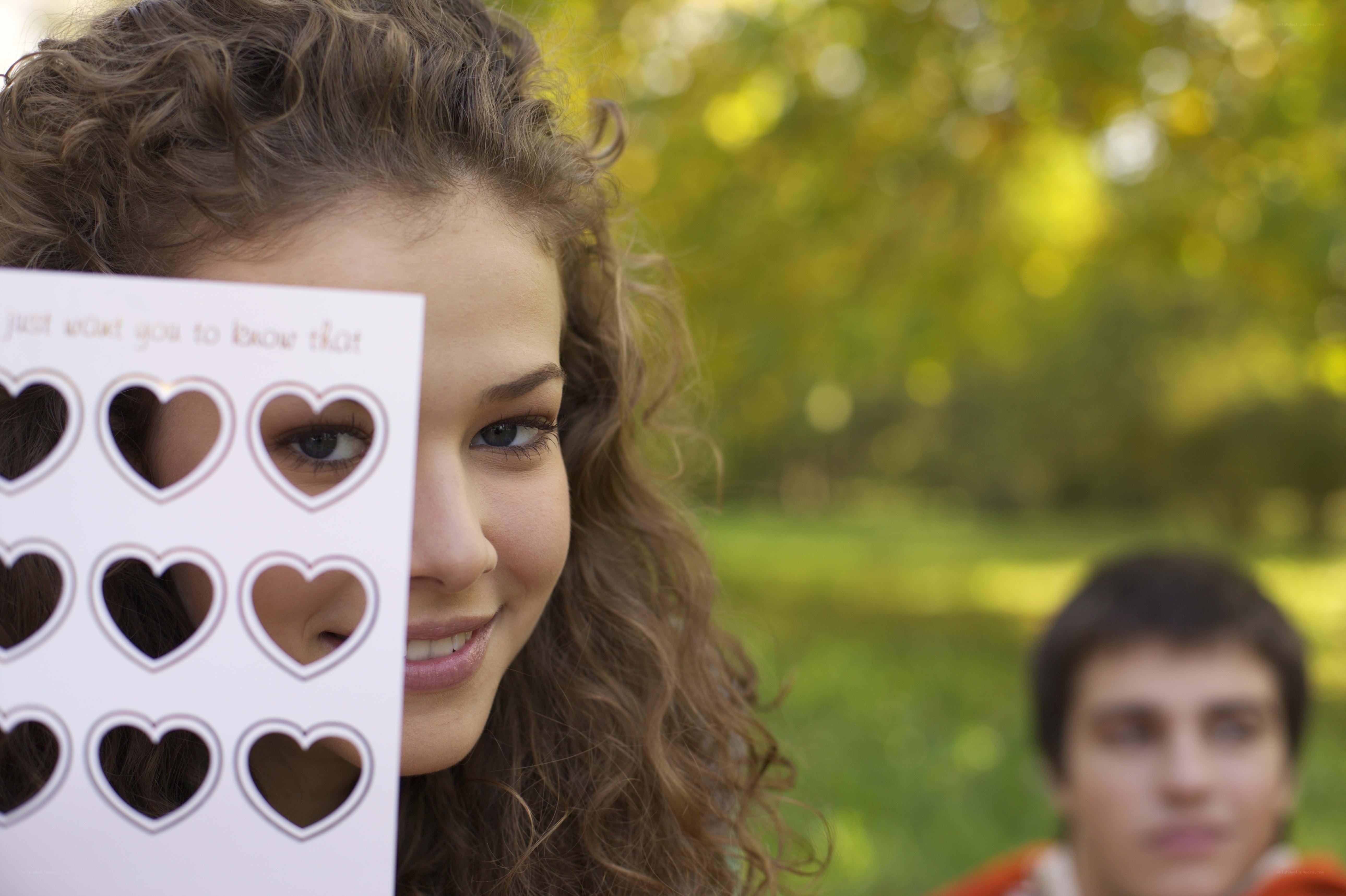 woman holding heart card
