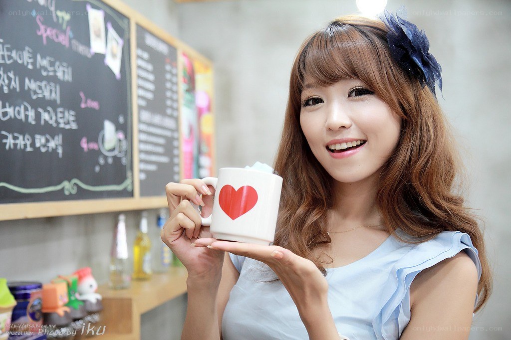 Woman holding heart mug