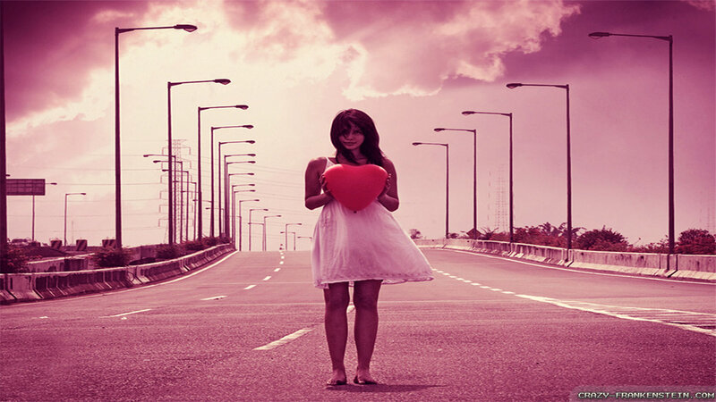 Woman Holding Heart on Road