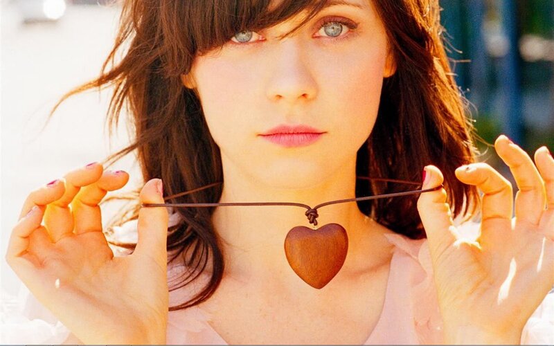 Woman Holding Heart Pendant — Brown