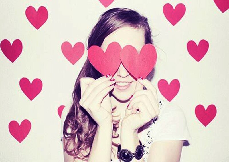 Woman Holding Hearts