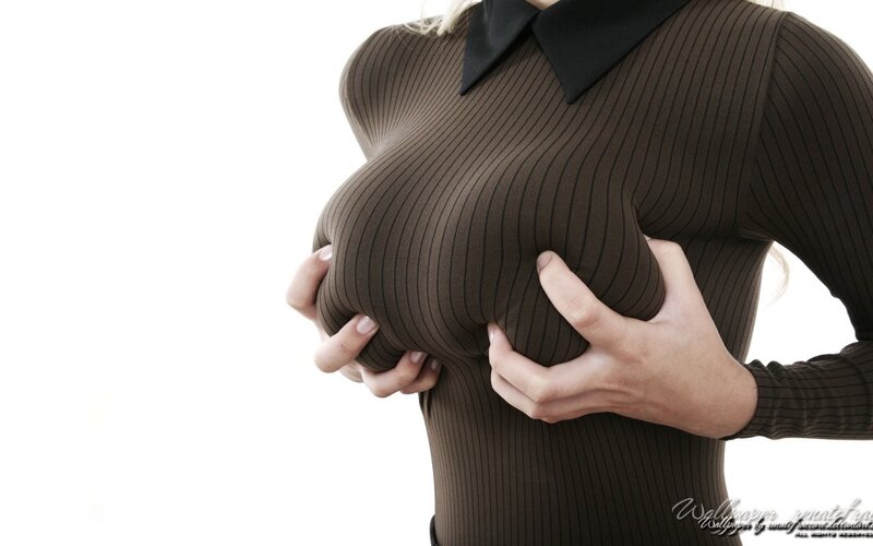 woman holding her breasts