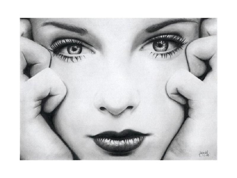 woman holding her face