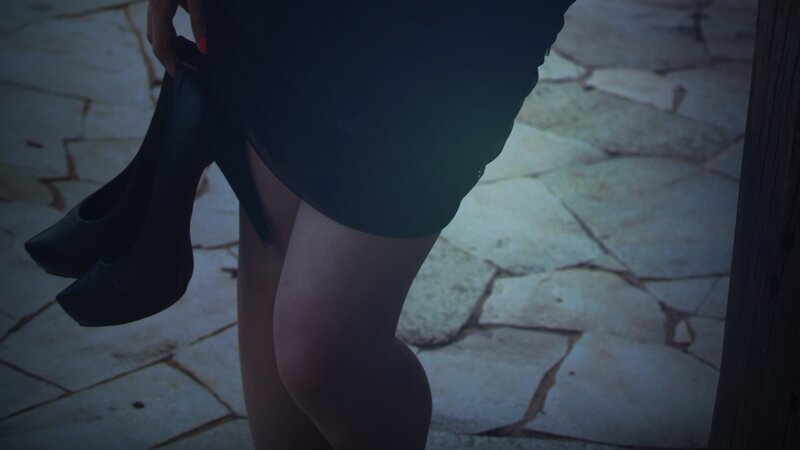 woman holding high heels