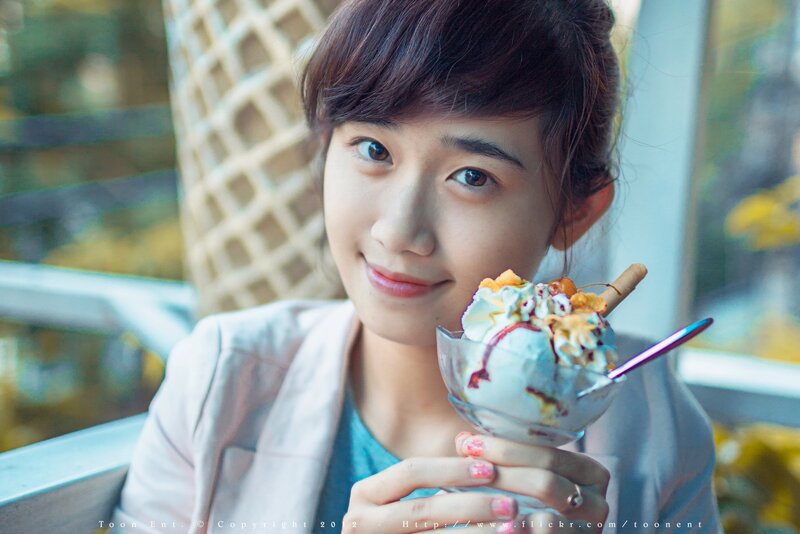 woman holding ice cream dessert